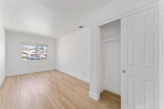 8798 Crest View Dr, Corona, CA 92883 - unfurnished bedroom with light wood-style flooring, baseboards, and a closet