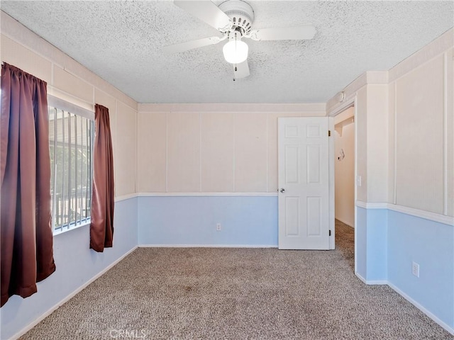 8307 Arrowhead Lake Rd, Hesperia, CA 92345 - unfurnished room with carpet floors, a textured ceiling, and a ceiling fan