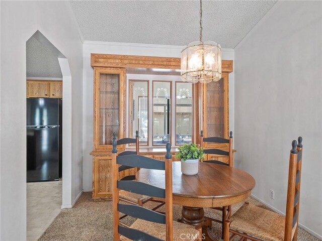 8307 Arrowhead Lake Rd, Hesperia, CA 92345 - dining area with a chandelier, crown molding, baseboards, light carpet, and a textured ceiling