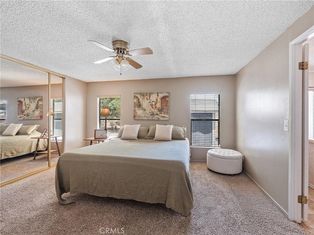 8307 Arrowhead Lake Rd, Hesperia, CA 92345 - bedroom featuring carpet flooring, a textured ceiling, ceiling fan, and multiple windows