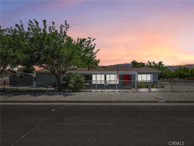 8307 Arrowhead Lake Rd, Hesperia, CA 92345 - manufactured / mobile home with a fenced front yard and a mountain view