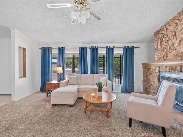 8307 Arrowhead Lake Rd, Hesperia, CA 92345 - living room with plenty of natural light, ceiling fan, a textured ceiling, carpet flooring, and a stone fireplace