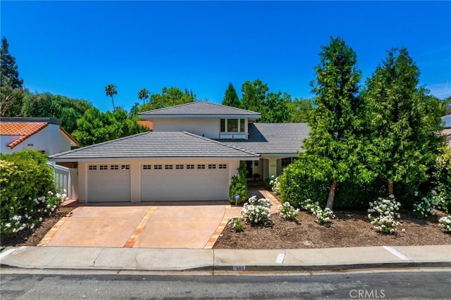 1683 Camberwell Pl, Westlake Village, CA 91361 - view of front of property with driveway, a garage, stucco siding, and a tile roof