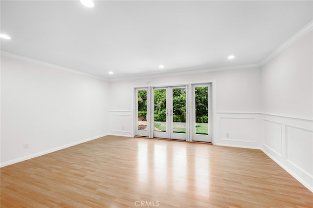 1683 Camberwell Pl, Westlake Village, CA 91361 - empty room featuring crown molding, a decorative wall, light wood-style floors, recessed lighting, and french doors