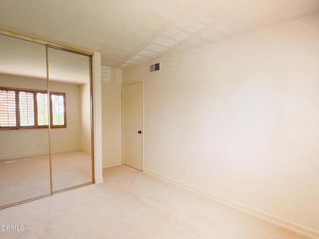 528 N Orange Grove Blvd, Pasadena, CA 91103 - unfurnished bedroom featuring a closet, carpet floors, and baseboards