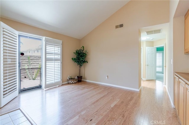 1049 Fairview Ave Unit 5, Arcadia, CA 91007 - spare room featuring light wood finished floors, high vaulted ceiling, and baseboards