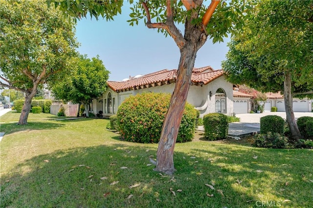 1049 Fairview Ave Unit 5, Arcadia, CA 91007 - mediterranean / spanish home featuring a garage, a tile roof, stucco siding, driveway, and a front yard