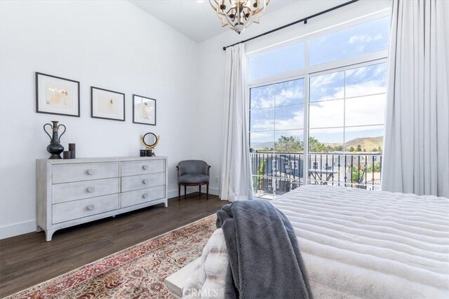 4029 Bernardo Dr, San Luis Obispo, CA 93401 - bedroom featuring dark wood-style floors, access to exterior, multiple windows, and vaulted ceiling
