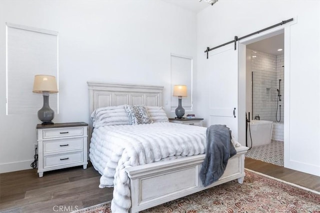 4029 Bernardo Dr, San Luis Obispo, CA 93401 - bedroom featuring a barn door, wood finished floors, baseboards, and ensuite bathroom