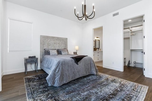 4029 Bernardo Dr, San Luis Obispo, CA 93401 - bedroom with a chandelier, wood finished floors, a walk in closet, and baseboards