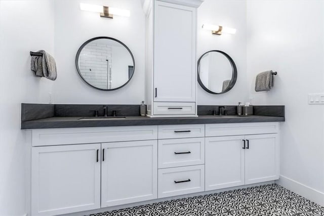 4029 Bernardo Dr, San Luis Obispo, CA 93401 - bathroom featuring double vanity and baseboards