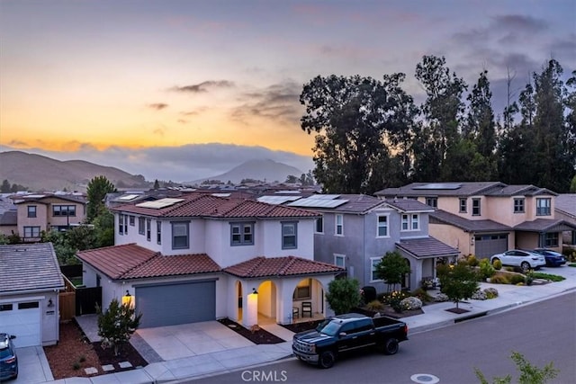 4029 Bernardo Dr, San Luis Obispo, CA 93401 - view of front facade with a residential view, stucco siding, concrete driveway, and a mountain view