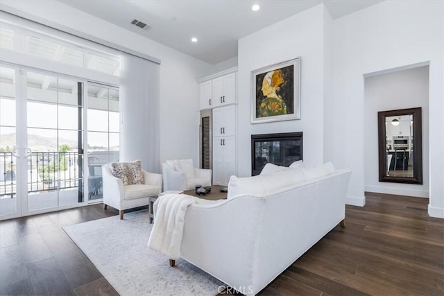 4029 Bernardo Dr, San Luis Obispo, CA 93401 - living area with dark wood finished floors, recessed lighting, a glass covered fireplace, and baseboards