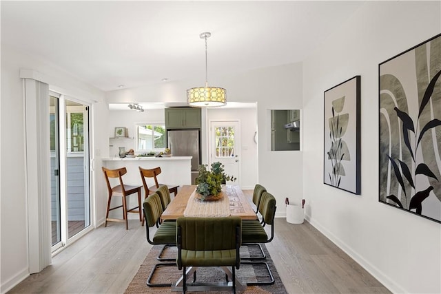 14911 Van Buren Ave, Gardena, CA 90247 - dining area with light wood-style floors and baseboards
