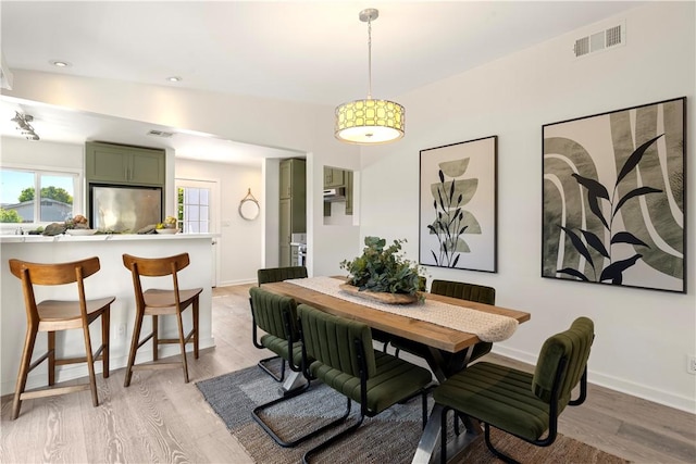 14911 Van Buren Ave, Gardena, CA 90247 - dining area with light wood-type flooring and baseboards