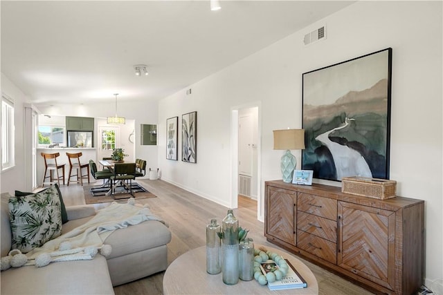 14911 Van Buren Ave, Gardena, CA 90247 - living room featuring light wood-type flooring and baseboards