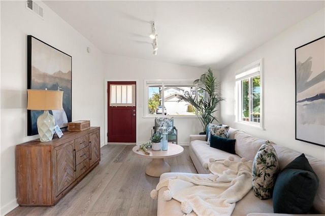 14911 Van Buren Ave, Gardena, CA 90247 - living room featuring lofted ceiling, light wood finished floors, baseboards, and track lighting