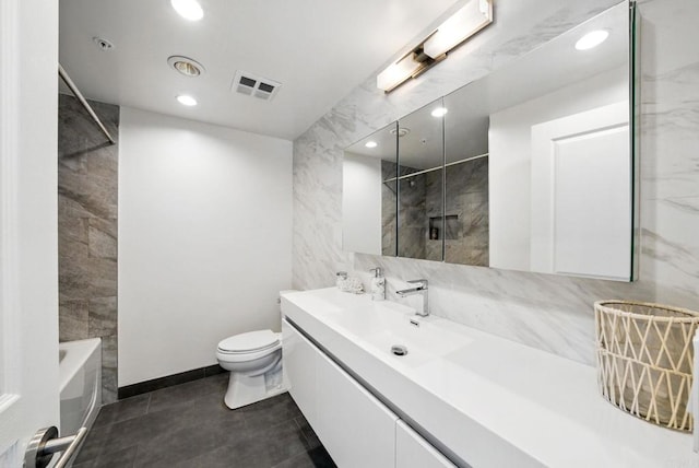 510 First Ave Unit 402, San Diego, CA 92101 - full bathroom featuring tile walls, vanity, toilet, recessed lighting, and tile patterned flooring