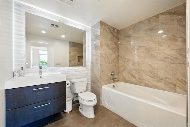 510 First Ave Unit 402, San Diego, CA 92101 - bathroom with tile walls, toilet, vanity, bathtub / shower combination, and tile patterned flooring