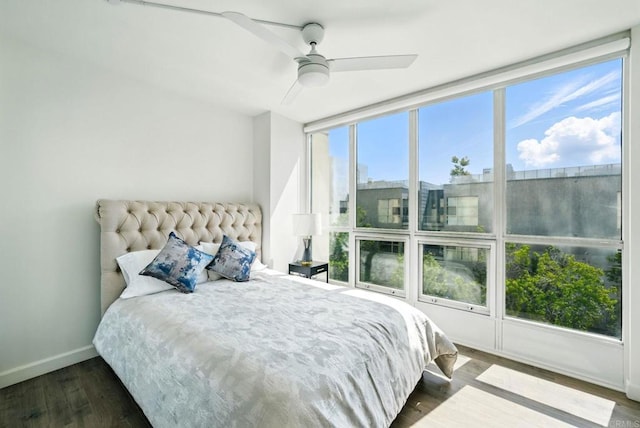510 First Ave Unit 402, San Diego, CA 92101 - bedroom with baseboards, dark wood-style flooring, and a ceiling fan