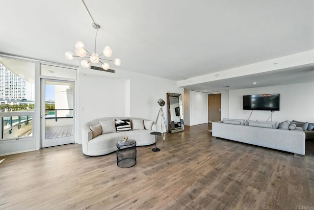 510 First Ave Unit 402, San Diego, CA 92101 - living room featuring wood finished floors and a chandelier