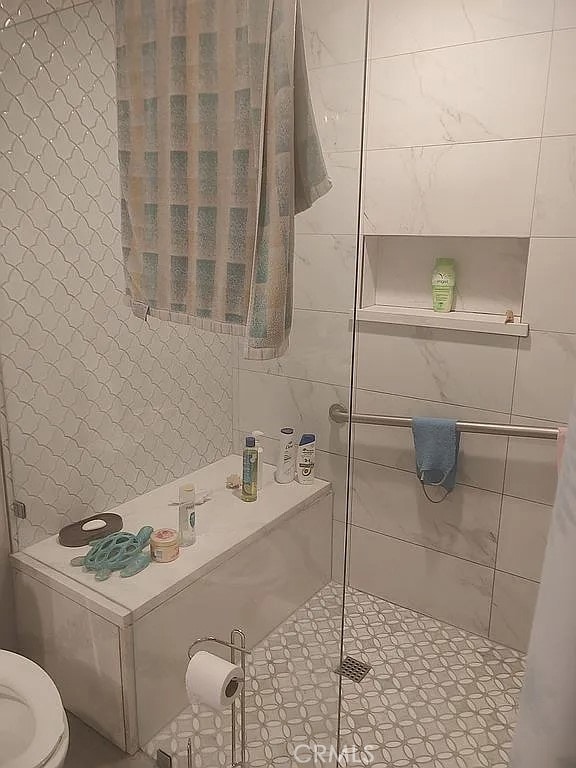 13914 Prichard St, La Puente, CA 91746 - full bath featuring toilet, tile walls, and tiled shower