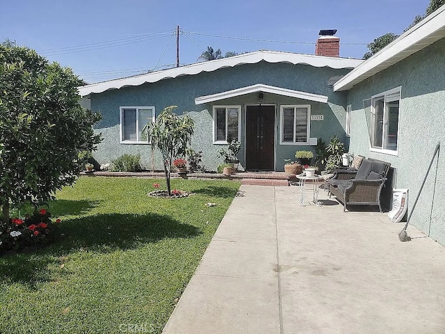 13914 Prichard St, La Puente, CA 91746 - view of front of property with stucco siding, a front yard, and a chimney