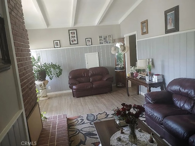 13914 Prichard St, La Puente, CA 91746 - living room featuring wood finished floors, wainscoting, and beam ceiling