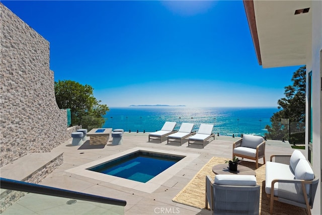 31 N Vista De Catalina, Laguna Beach, CA 92651 - view of pool featuring an outdoor fire pit, a water view, a patio area, and an in-ground hot tub