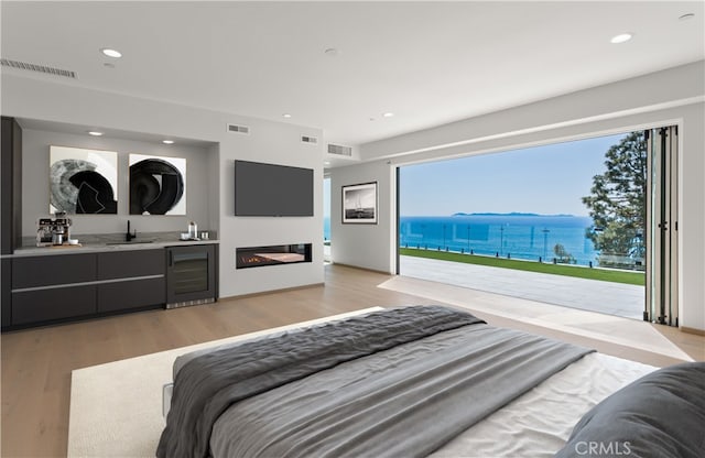 31 N Vista De Catalina, Laguna Beach, CA 92651 - bedroom featuring wine cooler, bar with sink, access to outside, light wood-type flooring, and recessed lighting
