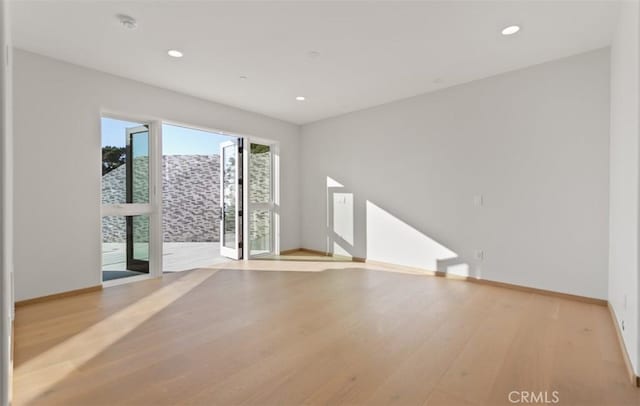 31 N Vista De Catalina, Laguna Beach, CA 92651 - unfurnished living room with light wood finished floors, baseboards, and recessed lighting