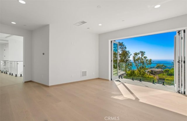 31 N Vista De Catalina, Laguna Beach, CA 92651 - unfurnished room featuring light wood-type flooring, recessed lighting, baseboards, and a water view