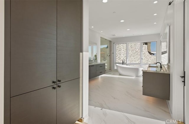31 N Vista De Catalina, Laguna Beach, CA 92651 - full bathroom featuring marble tiled flooring, vanity, recessed lighting, and a soaking tub
