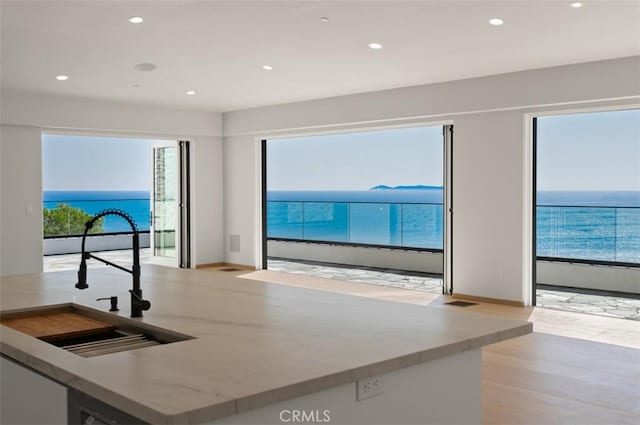 31 N Vista De Catalina, Laguna Beach, CA 92651 - kitchen with a sink, wood finished floors, recessed lighting, and a water view