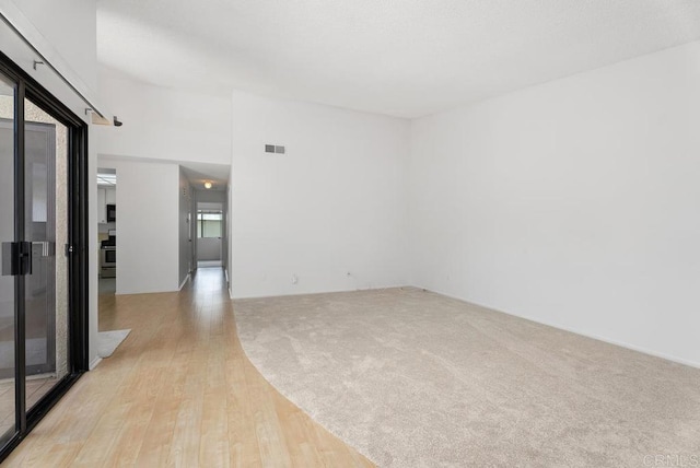 8933 Yolo Cir Unit 1308-A, Huntington Beach, CA 92646 - unfurnished room featuring light wood-style floors