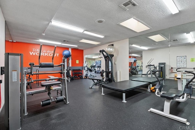 8933 Yolo Cir Unit 1308-A, Huntington Beach, CA 92646 - gym featuring a textured ceiling