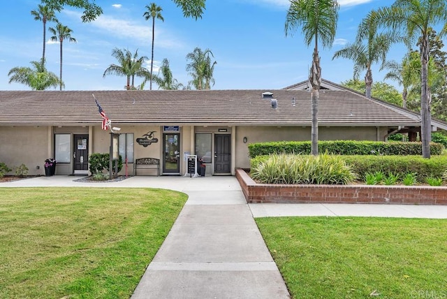 8933 Yolo Cir Unit 1308-A, Huntington Beach, CA 92646 - single story home with stucco siding, a front yard, and a tiled roof