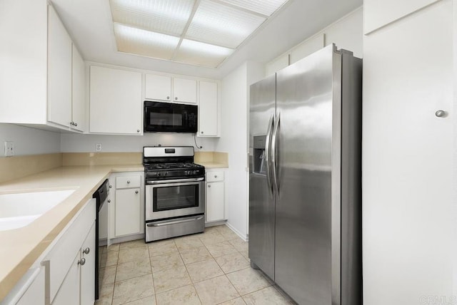 8933 Yolo Cir Unit 1308-A, Huntington Beach, CA 92646 - kitchen with black appliances, white cabinets, light countertops, and a sink