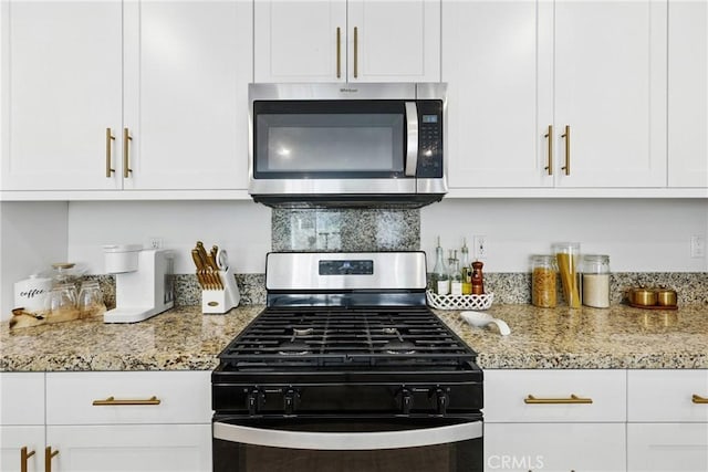 1782 Park Place Ln, Riverside, CA 92501 - kitchen featuring stainless steel microwave, gas range, white cabinets, and light stone countertops