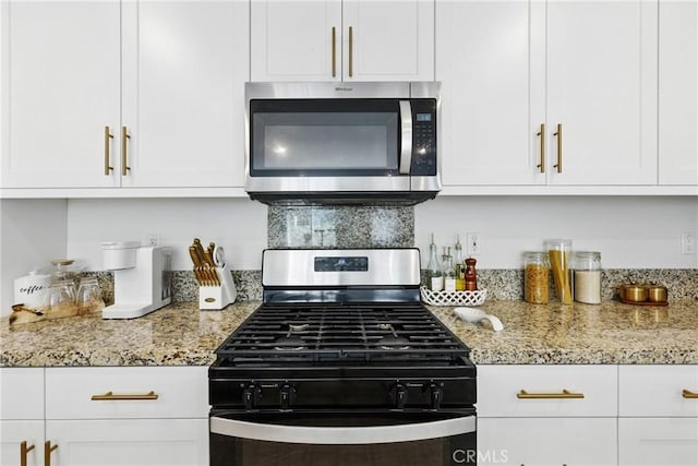 1782 Park Place Ln, Riverside, CA 92501 - kitchen featuring stainless steel appliances, white cabinets, and light stone countertops