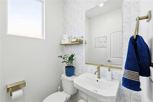 1782 Park Place Ln, Riverside, CA 92501 - half bathroom with wallpapered walls, toilet, and a sink