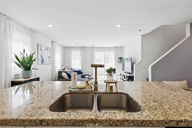 1782 Park Place Ln, Riverside, CA 92501 - kitchen featuring a sink, open floor plan, light stone counters, and recessed lighting