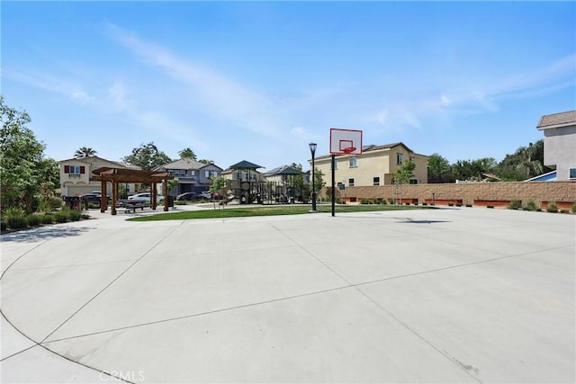 1782 Park Place Ln, Riverside, CA 92501 - view of sport court featuring community basketball court, a pergola, and a residential view