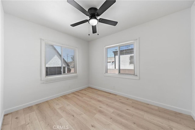 407 W 107th St, Los Angeles, CA 90003 - spare room featuring light wood-style floors and baseboards