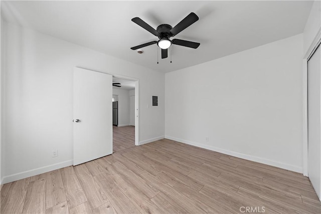 407 W 107th St, Los Angeles, CA 90003 - unfurnished room featuring light wood-style flooring, a ceiling fan, and baseboards