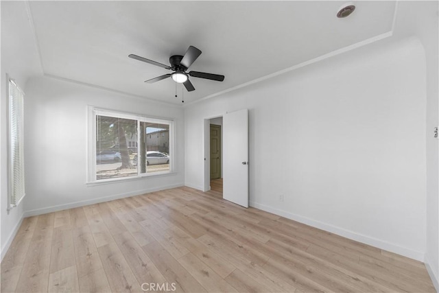 407 W 107th St, Los Angeles, CA 90003 - empty room with light wood finished floors, a ceiling fan, and baseboards