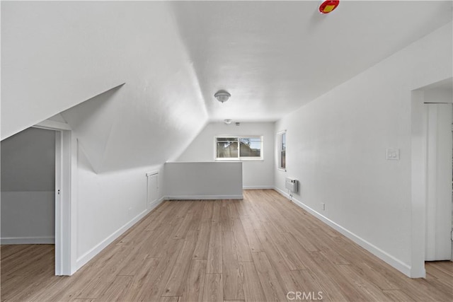 407 W 107th St, Los Angeles, CA 90003 - additional living space featuring wood finished floors, lofted ceiling, and baseboards
