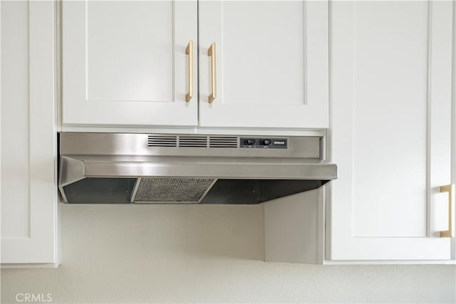 407 W 107th St, Los Angeles, CA 90003 - kitchen view of under cabinet range hood and white cabinetry