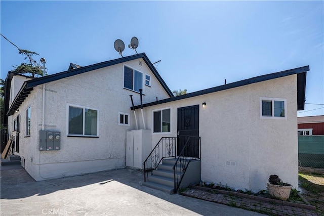 407 W 107th St, Los Angeles, CA 90003 - rear view of property featuring stucco siding