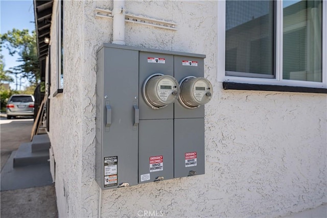 407 W 107th St, Los Angeles, CA 90003 - exterior view of stucco siding and electric meter